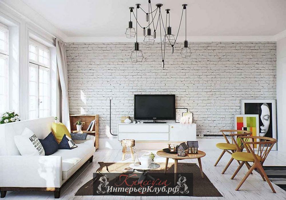 Белая кирпичная стена как текстурный акцент в интерьере скандинавской квартиры